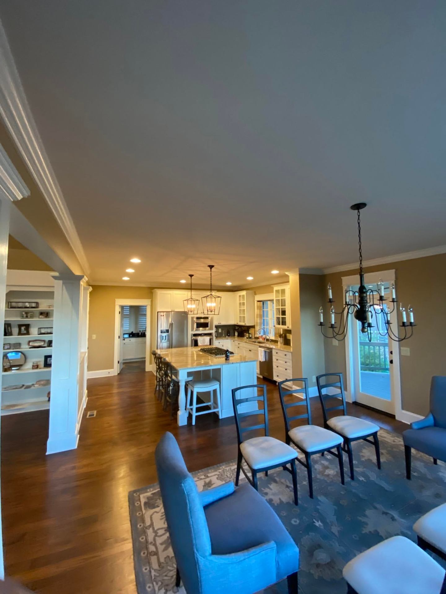 Open-concept kitchen and dining room with refreshed interior paint